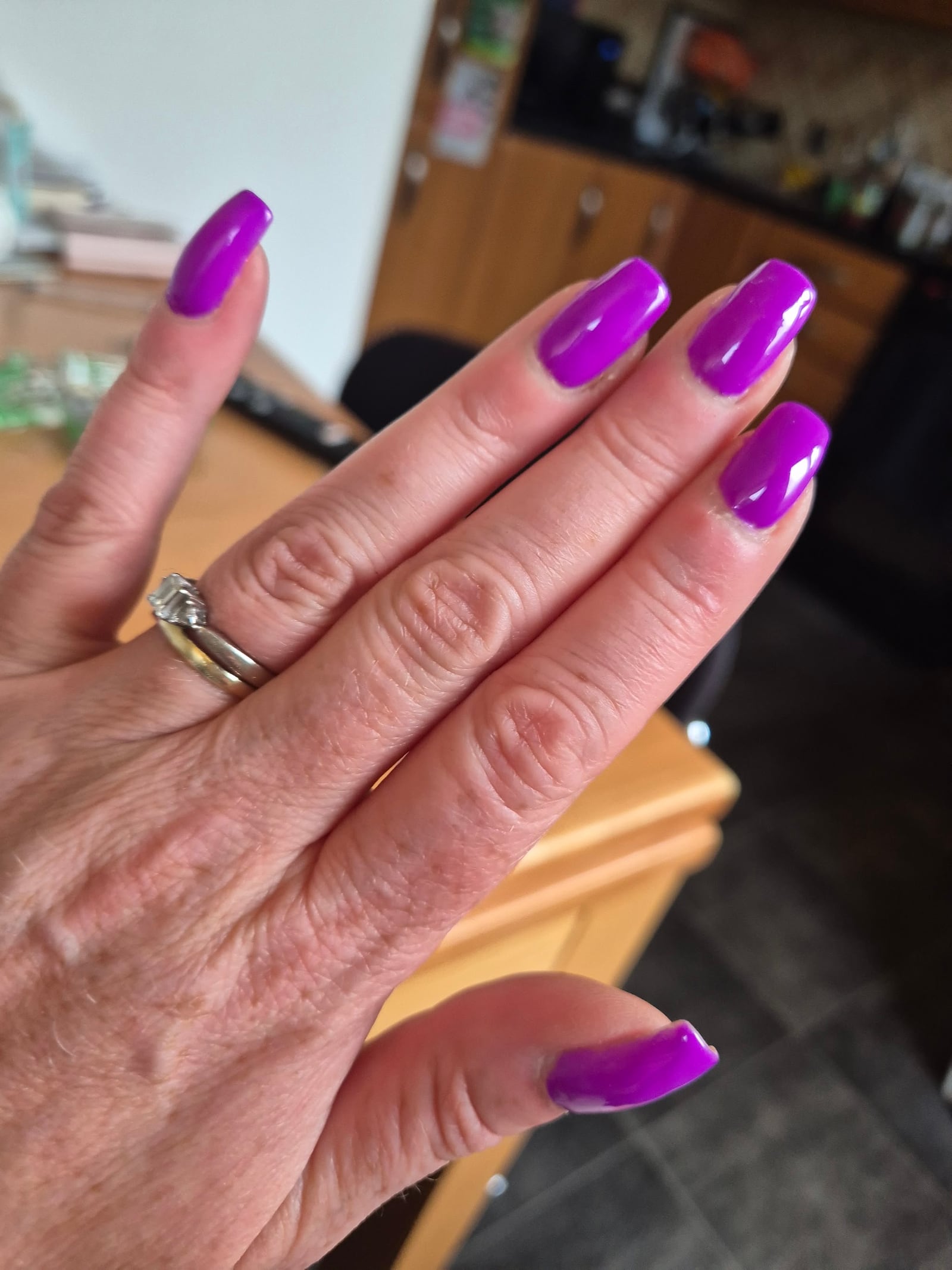 A finished violet manicure photographed by Tara Fox